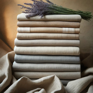 A highly detailed image illustrating the heirloom stitch being used to repair a small tear in the tablecloth. The image clearly shows the needle and thread, the weave of the fabric, and the precise movements of the stitch.
