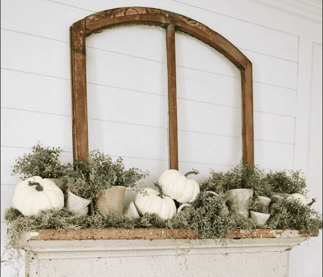 A rustic farmhouse fall mantel with a focus on natural elements and a warm, inviting atmosphere