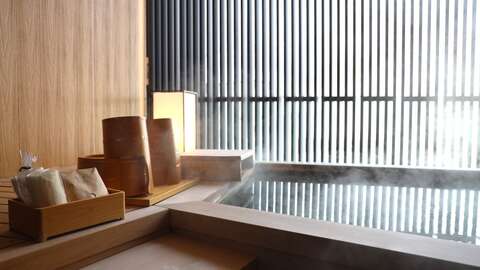 Yukoro Onsen with Mount Yotei in the background, and the relaxation of the individuals within the Onsen