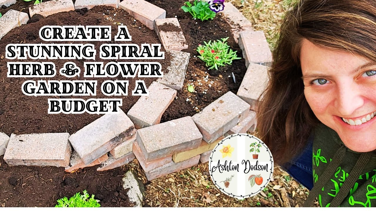 pile of reclaimed bricks, compost bags, and herb seedlings