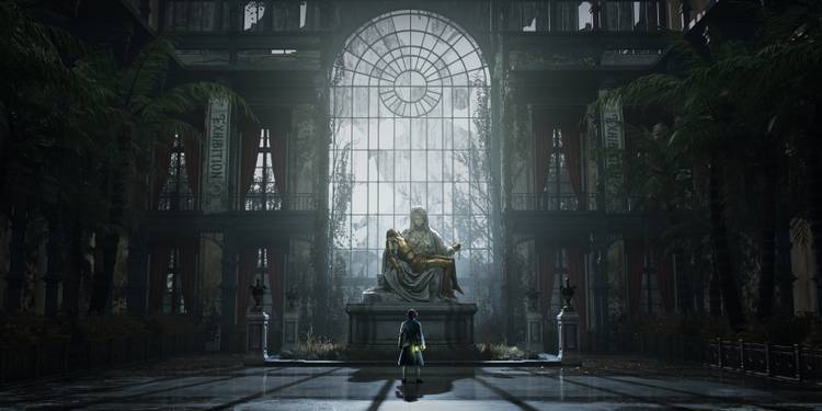 A somber and atmospheric shot of a gaslit street in Krat, the game's main city. The architecture is Victorian-era, with ornate details and a sense of decay. Fog hangs in the air, and dim lights cast long shadows.