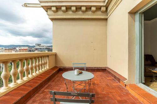 A close-up, detailed shot of a hidden courtyard in the Gothic Quarter, focusing on the architectural details and textures of the building.