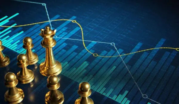 A diverse group of game developers collaborating in a modern office setting, reflecting the teamwork required for successful studio operations.