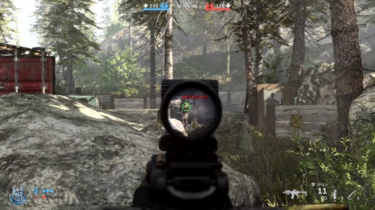 An action shot of a firefight in GTA V with the Realism Overhaul mod installed. The image shows realistic weapon effects, particle physics, and enemy AI behavior.