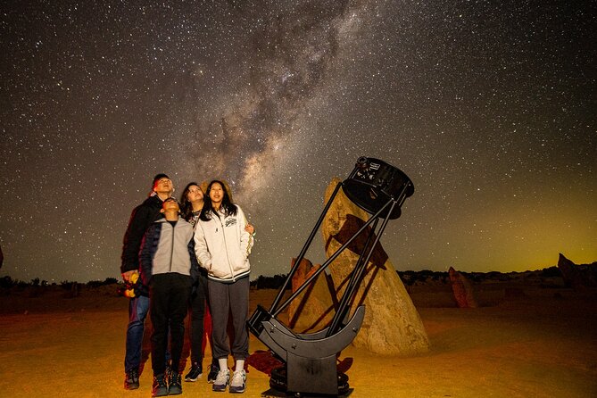 A portrait of Sofia with Elena, an indigenous guide, during a stargazing tour. Natural light captures the genuine connection and storytelling.