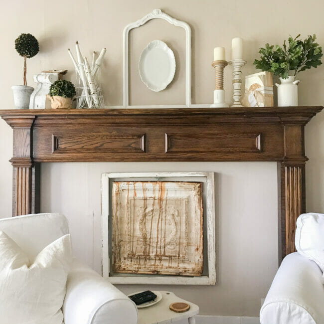 A light brown mantle with greenery on it