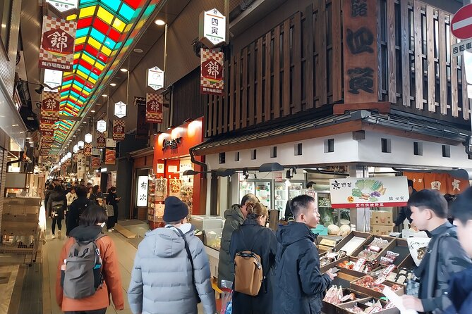 A street lined with traditional wooden buildings and lanterns in Kyoto
