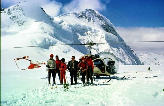 A hiker on Trolltunga, Norway, with a stunning view of the lake below.