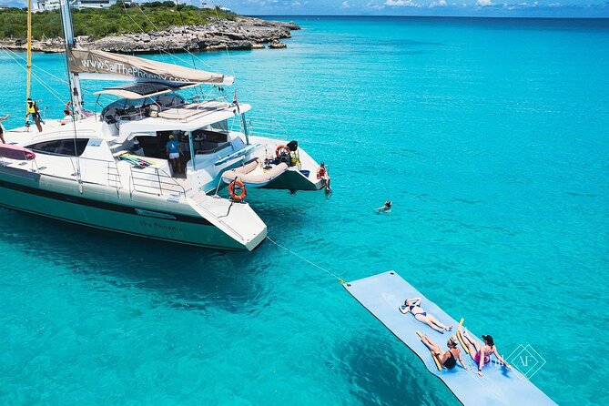 Luxury catamaran sailing in the British Virgin Islands, showing turquoise waters and bright sunshine