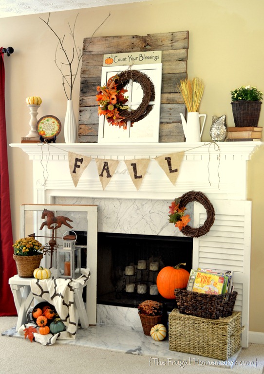 A fall mantel incorporating stacked vintage books and a mason jar filled with fall foliage