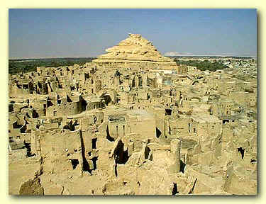 The ancient Shali Fortress rises majestically from the desert landscape, showcasing the unique architecture of Siwa Oasis.