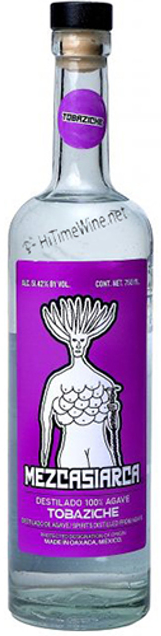 Taken at Tlayudas El Negro at night. Use long exposure to capture the street scene, and focus on a close-up shot of a tlayuda being assembled on a charcoal grill, highlighting the sizzle and the aroma of the cooking process, with bokeh lights in the background.