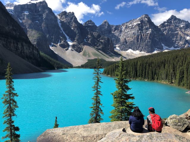 Vibrant turquoise lake reflecting mountains in the Canadian Rockies