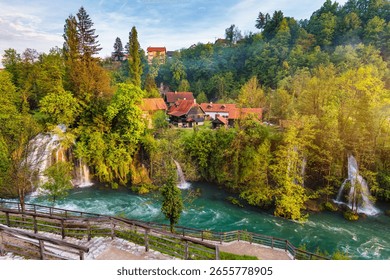Panoramic view of Plitvice Lakes from the Upper Lakes Trail, showcasing the tiered lakes and surrounding forests.