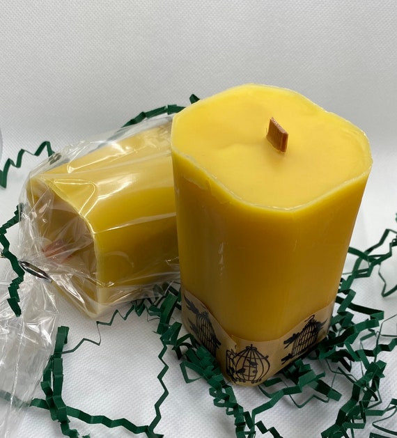 Close up of the finished Yule Beeswax Candle Centerpiece in a low lit room.