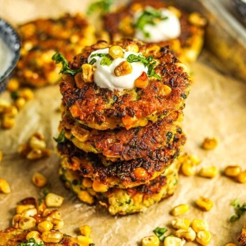 Fritters frying in a cast iron skillet, sizzling in oil