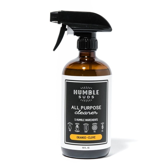 Hand cleaning kitchen counter orange peels