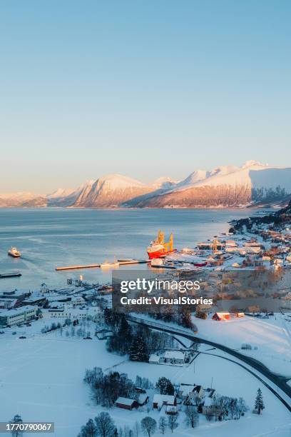 Ski touring in the Hjørundfjord with steep mountains rising directly from the sea