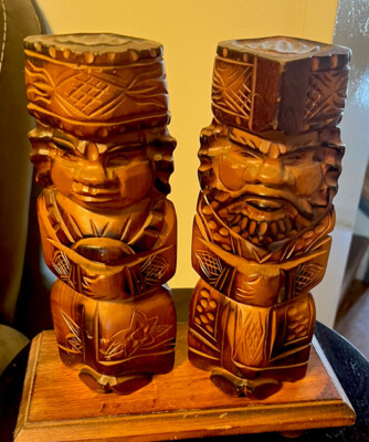 Long exposure shot of a line of headlamps snaking down Asahidake at night, captured with a cinematic camera, immediately followed by a steaming onsen scene with snow-covered peaks framed in the background