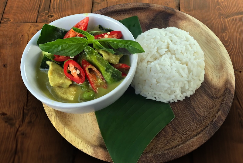 A photo of the Rabbit Card being used at a BTS station, focusing on the vibrant colors of the card and the sleek design of the station.