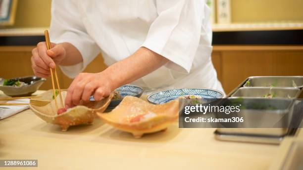 Restaurant Environment: Intimate and homely atmosphere in a family run restaurant. This photo should have subtle low-key lighting that highlights the textures of the wood and natural elements.