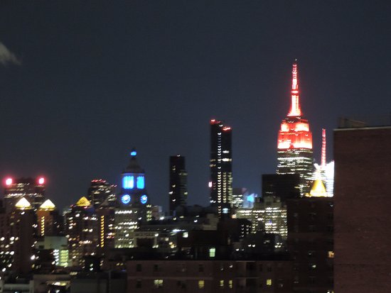 Bathroom at The Ludlow Hotel with marble detailing and a large rain showerhead. Lena used this space for capturing self-portraits using reflective surfaces and diffused light.