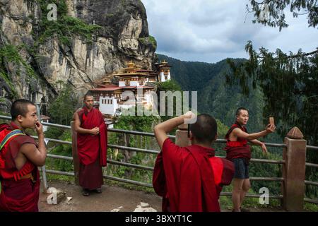Anya, the digital nomad, enjoying a cup of Suja (butter tea) with a local Bhutanese family, showcasing the warmth and hospitality of the Bhutanese people.