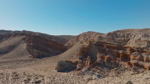 Researchers capturing sounds of the desert at sunset using specialized equipment in the Sahara Desert.