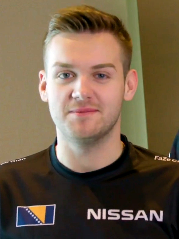 A determined Counter-Strike player strategizing with hand gestures, reflecting the intensity of the game.