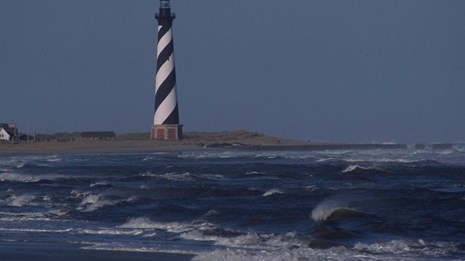 The Cape Hatteras Lighthouse towering over the landscape