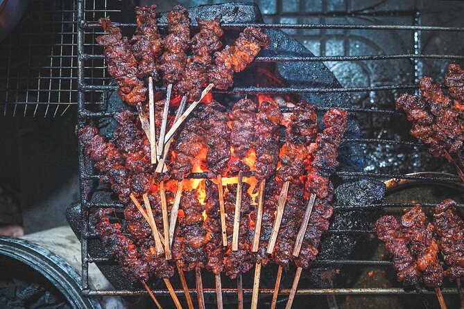 Dorm room sleeping area with several bunks.