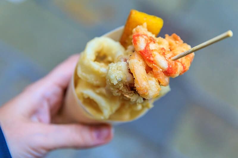 A close-up of sfogliatella pastries in a Naples bakery, showcasing their flaky texture and sweet filling