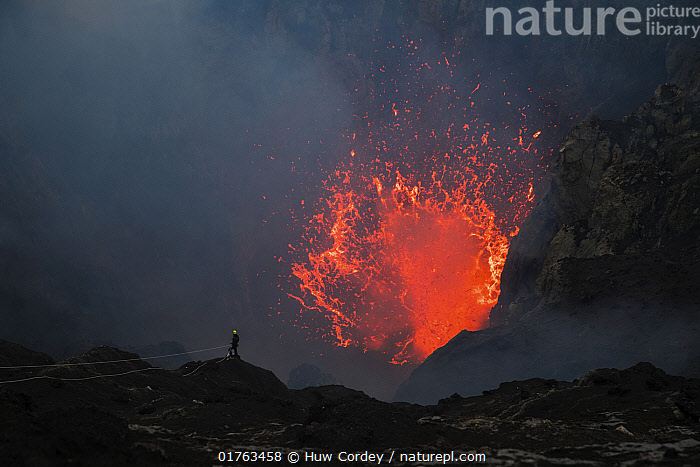 Mount Yasur erupting at sunset, painting the sky with fiery hues