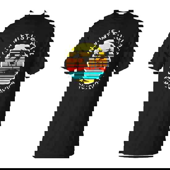 A wide shot of a family walking on a sandy beach towards the ocean, bathed in warm sunlight. The children are laughing and playing with a beach ball, and the parents are smiling warmly. This image showcases the joy and connection that family beach vacations foster.