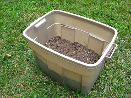 Attaching pallets together to form the frame of the compost bin