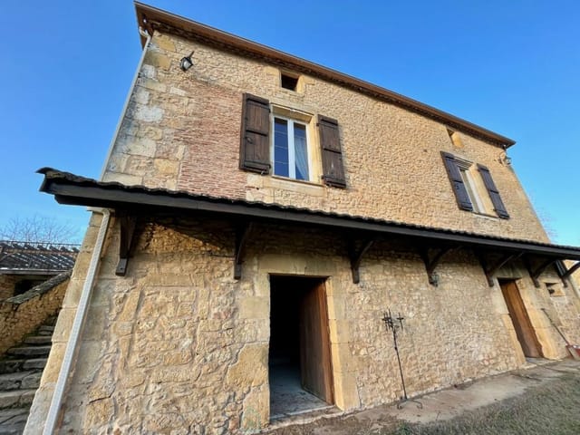 An overview of the exterior of a house and its surroundings.