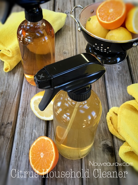 Ingredients for homemade citrus cleaner: citrus peels, white vinegar, essential oils