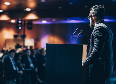 A scene from the TikTok video, with a cheerful AI avatar interviewing a real volunteer in a colorful, animated setting