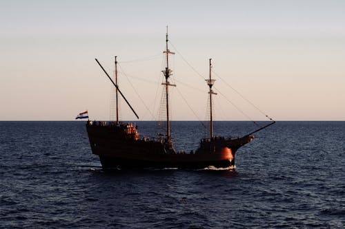 Star Clipper under full sail in the Adriatic Sea, emphasizing its grandeur against the Croatian coastline