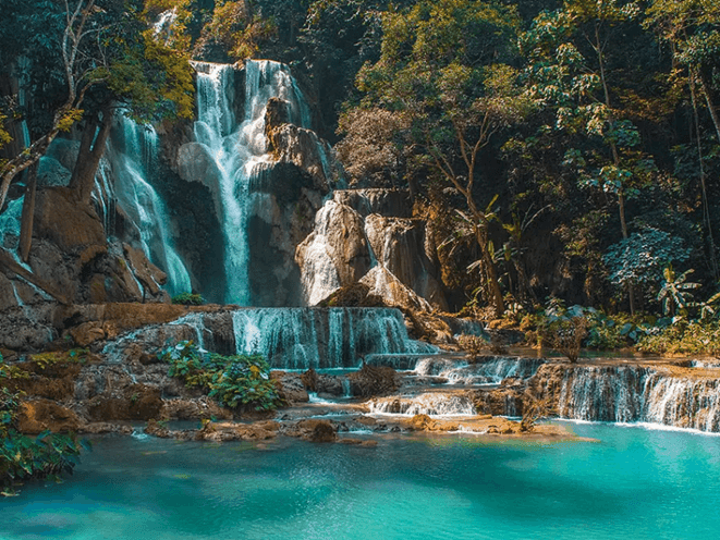The turquoise waters of Kuang Si Falls offer a refreshing escape and a moment of connection with nature.