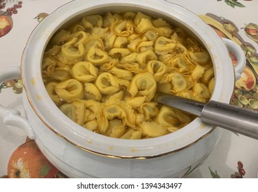 A plate of golden-brown Crescentina, also known as Gnocco Fritto, served with various cured meats and cheeses.