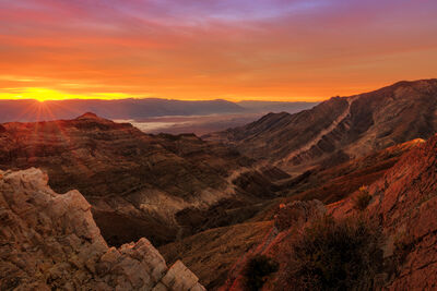 The surreal landscape of Death Valley, featuring the salt flats and mountain ranges.