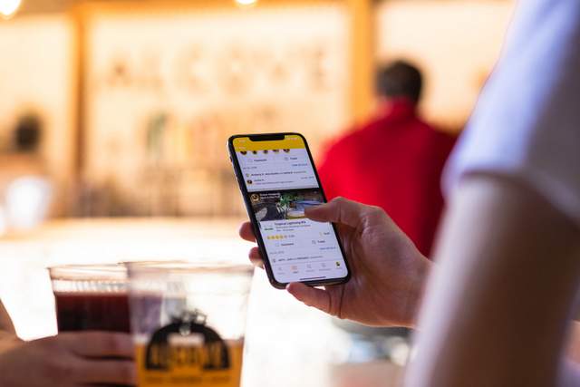 Happy customers enjoying beers at HopHarbor Brewing