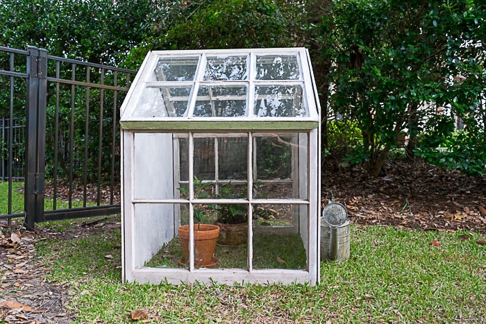 A completed cold frame with added insulation inside, showing bubble wrap lining the frame.