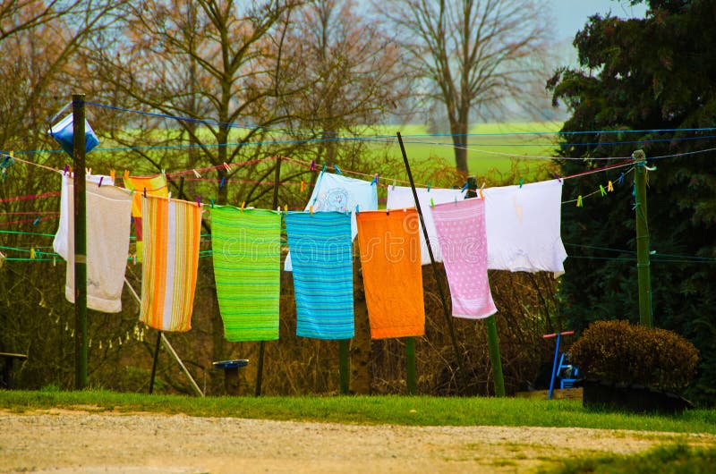 A close-up of wooden clothespins hanging on a clothesline, adding a rustic touch.