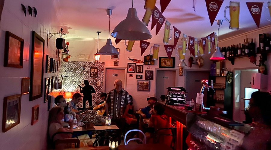 A Fado performance in a dimly lit Tasca in Alfama