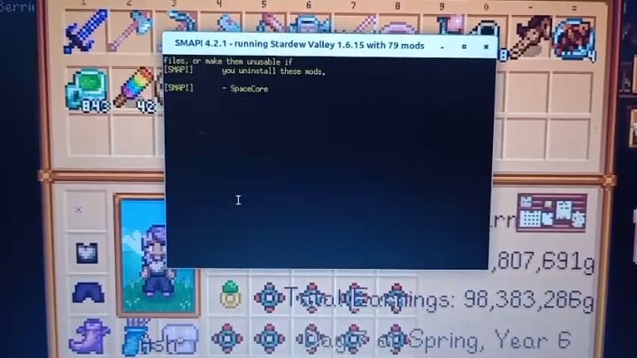 A screenshot showcasing the altered buildings in Stardew Valley after installing the Medieval Buildings mod. Capture a variety of buildings, such as the player's farmhouse (with a stone exterior and thatched roof), the general store (now a stone-built marketplace), and the blacksmith (appearing more like a medieval forge), to showcase the re-theming effect. Use a wide-angle shot to show the buildings in context, with the surrounding environment featuring rolling green hills and a clear blue sky.