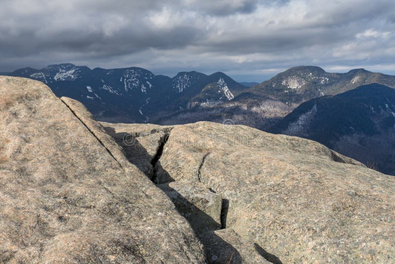 A historical fire tower in the Adirondacks, showcasing its weathered wood and intricate ironwork, adding a historical dimension to the hiking experience.