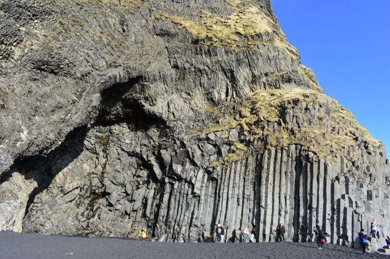 Close-up of black sand at Reynisfjara, Iceland, showcasing texture and light