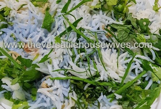 Vibrant bowls of Nasi Kerabu with multiple ingredients